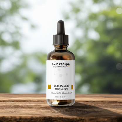 Bottle of skin recipe Multi-Peptide Hair Serum on a wooden surface with a blurred green background